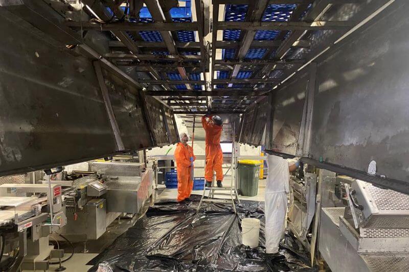 Rapid Facility workers conducting industrial cleaning
