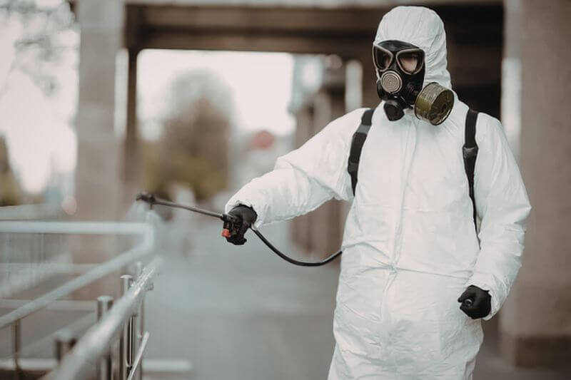 Industrial cleaner with full PPE gear