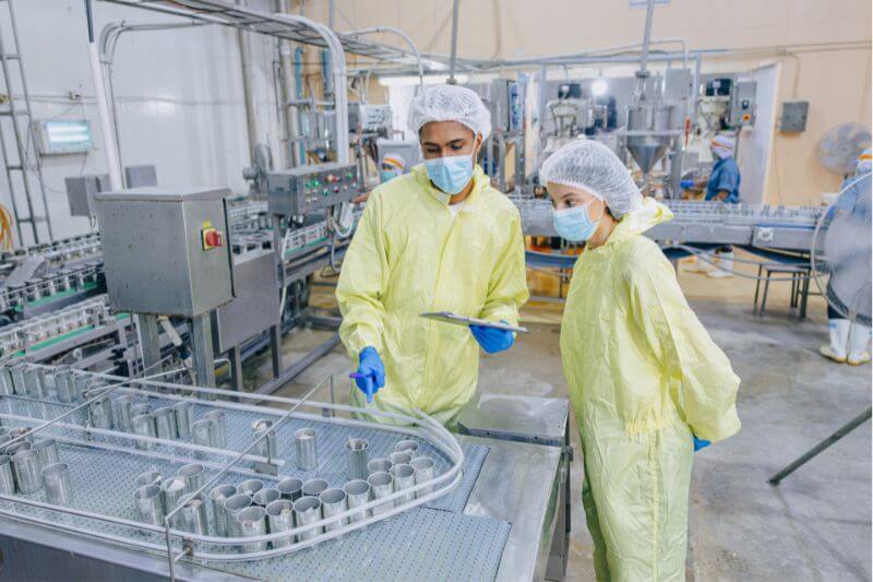 Two food auditors in food factory