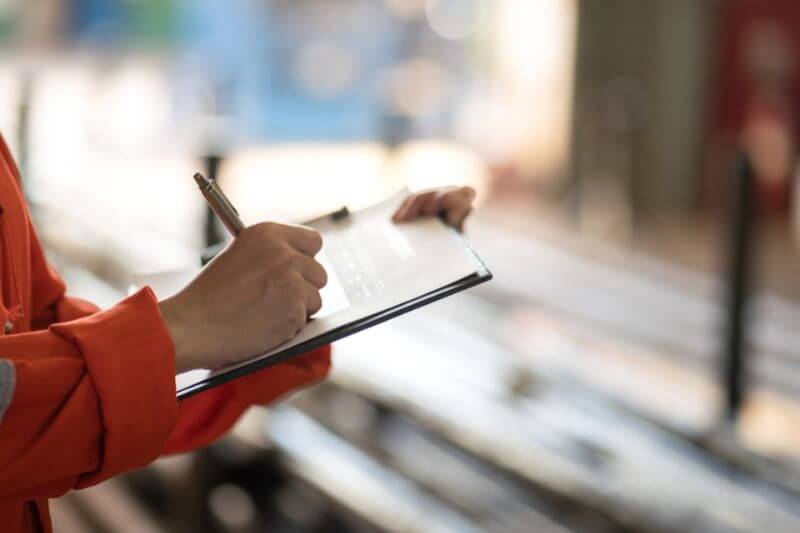 Writing down notes on clipboard