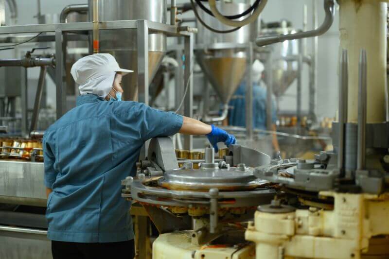 Food factory worker in facility