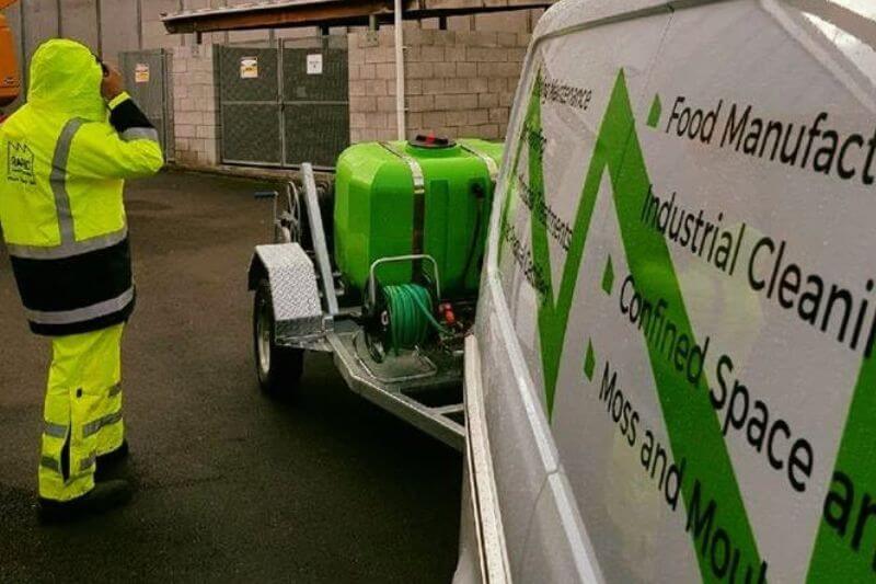 Rapid Facilities worker near company van