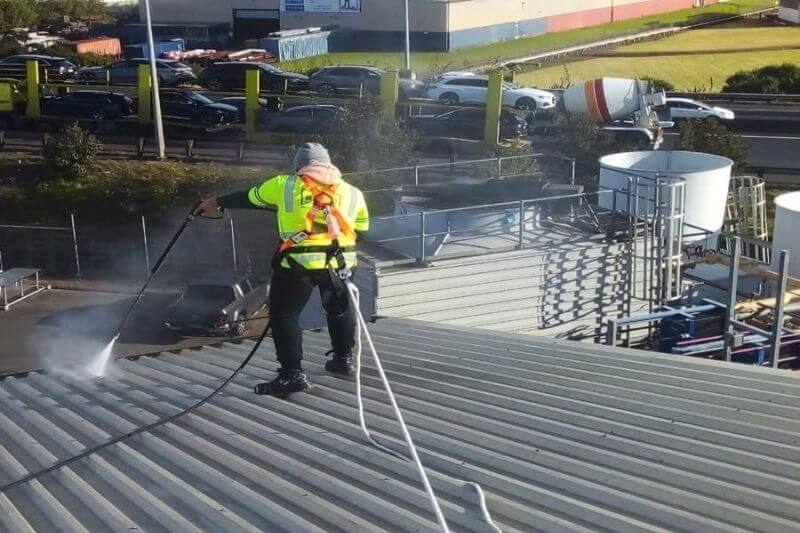 Rapid Facilities industrial cleaner on top of roof